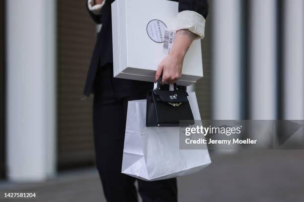 Maria Barteczko seen wearing a black classic blazer by WENDYKEI, a black longsleeve by WENDYKEI, WENDYKEI black skinny pants, a grey logo baseball...