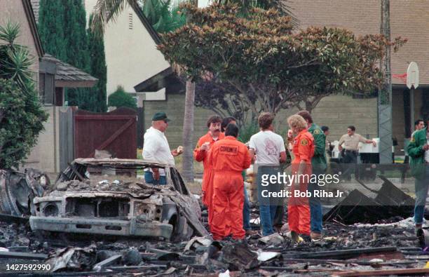 Los Angeles County Fire, Sheriff and Coroner Officials work within the debris field after mid-air collision with Aeromexico Flight 498 and Piper...