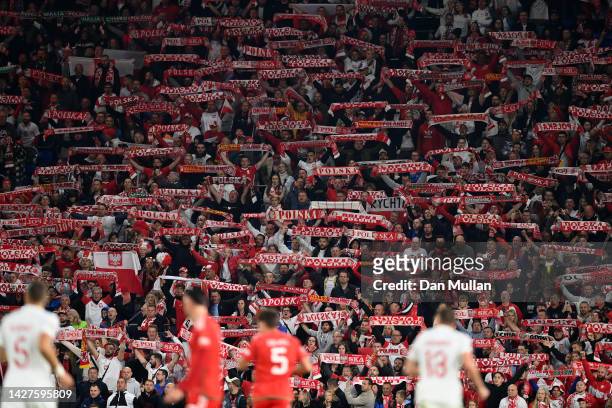Poland fans hold scarves to show their support during the UEFA Nations League League A Group 4 match between Wales and Poland at Cardiff City Stadium...