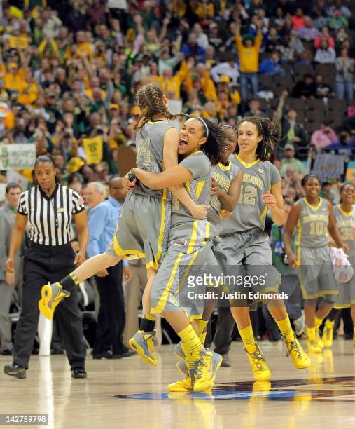 Makenzie Robertson, Mariah Chandler and Brittney Griner of the Baylor Bears celebrate after they won 80-61 against the Notre Dame Fighting Irish...