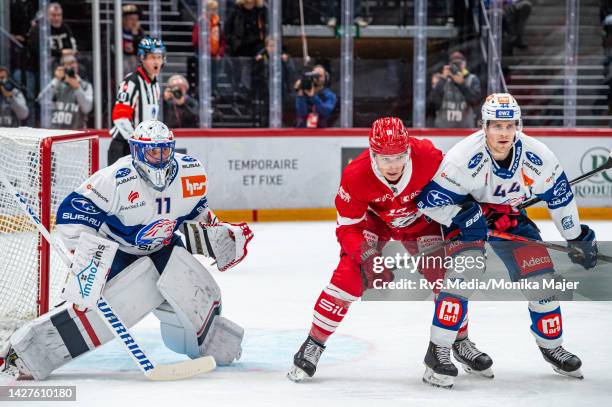 Floran Douay of Lausanne HC, Mikko Lehtonen of ZSC Lions and Goalie Simon Hrubec of ZSC Lions in action during the Swiss National League game between...