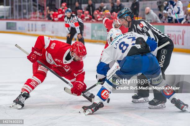 Jason Fuchs of Lausanne HC face-off against Juho Lammikko of ZSC Lions during the Swiss National League game between Lausanne HC and ZSC Lions at...