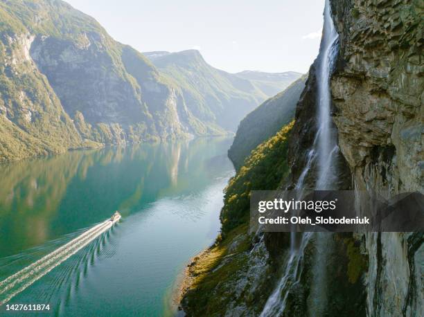 aerial view of cruise ship near seven sisters waterfall - norwegian culture stockfoto's en -beelden