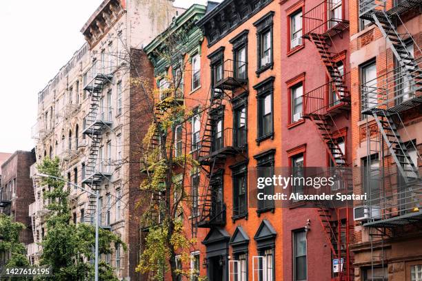 apartment building in east village, new york city, usa - manhattan autumn stock-fotos und bilder