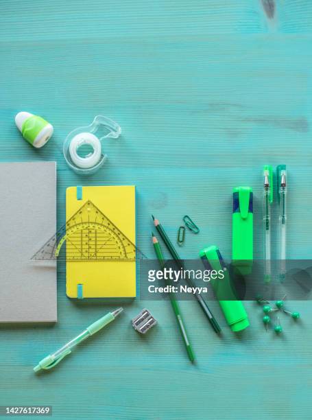 colorful school supplies on blue wooden background - ruler desk stock pictures, royalty-free photos & images