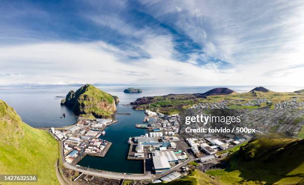the harbor and the town vestmannaeyjar,vestmannaeyjar,iceland - westman islands stock-fotos und bilder
