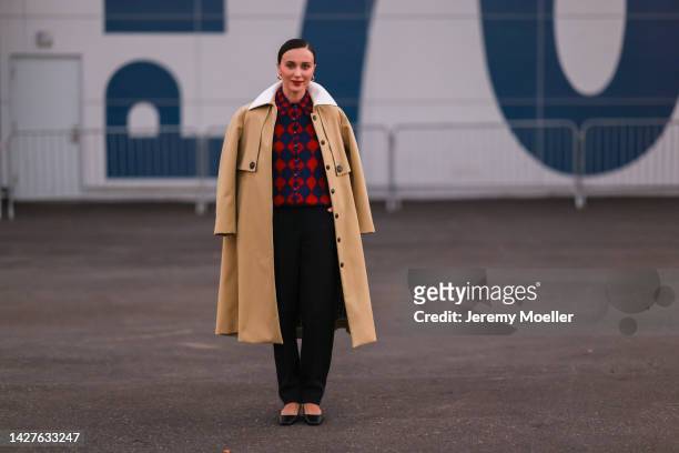 Mary Leest seen wearing a beige coat with a multicolored blouse, outside Tory Burch Show during New York Fashion Week on September 13, 2022 in New...