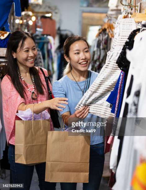 korean mother and daughter shopping at clothing store - korean teen bildbanksfoton och bilder