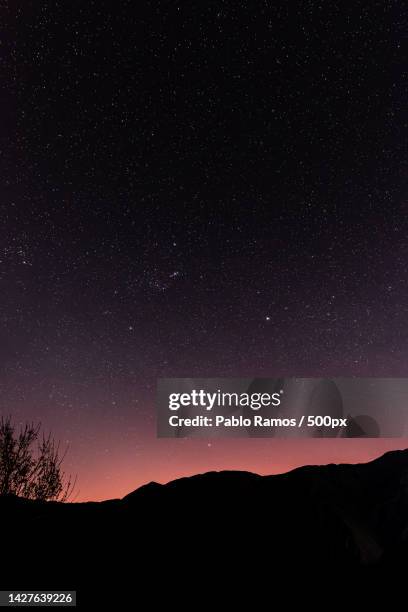 scenic view of silhouette of mountains against sky at night - ecossistema stock pictures, royalty-free photos & images