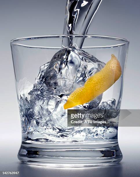 pouring vodka over ice - ウォッカ ストックフォトと画像