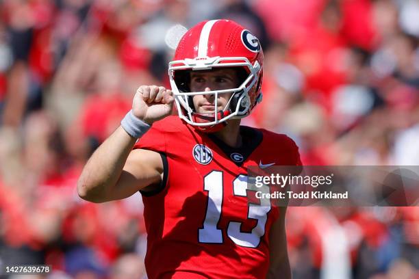 Stetson Bennett of the Georgia Bulldogs signals fourth down during the second half against the Kent State Golden Flashes at Sanford Stadium on...