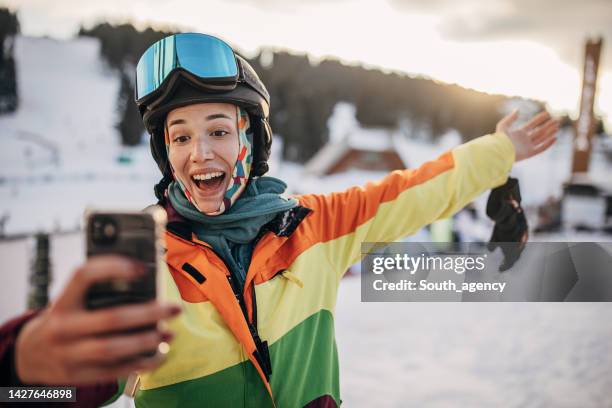 skier taking a selfie - white glove phone stock pictures, royalty-free photos & images