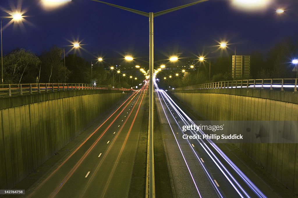 Trailing vehicle lights on tunnel road