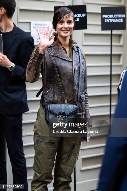 Model Taylor Hill is seen wearing a green jumpsuit, brown leather jacket and Etro bag outside the Ferrari show during the Milan Fashion Week -...
