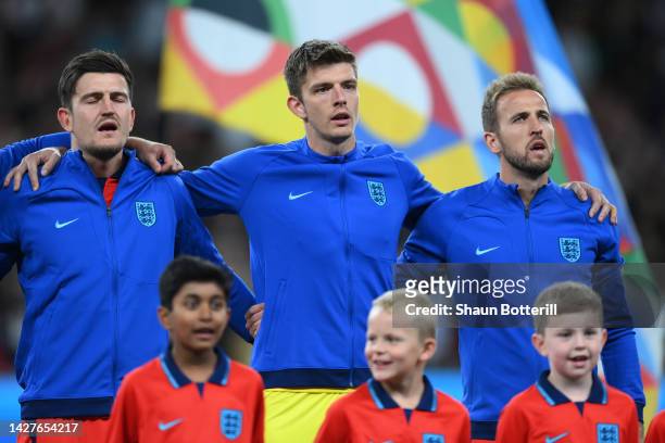 Harry Maguire, Nick Pope and Harry Kane of England stand for the national anthem prior to the UEFA Nations League League A Group 3 match between...