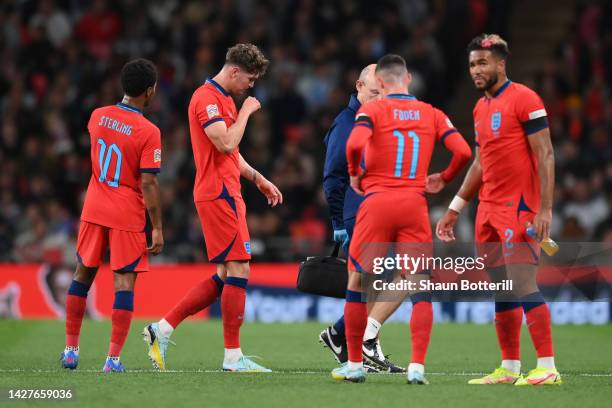 John Stones of England leaves the field after suffering an injury during the UEFA Nations League League A Group 3 match between England and Germany...