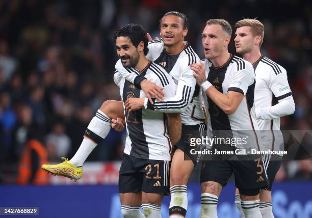 Ilkay Gundogan of Germany celebrates with Leroy Sane and David Raum after scoring the opening goal during the UEFA Nations League League A Group 3...