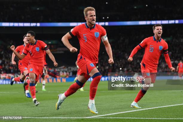 Harry Kane of England celebrates after scoring their team's third goal from the penalty spot during the UEFA Nations League League A Group 3 match...