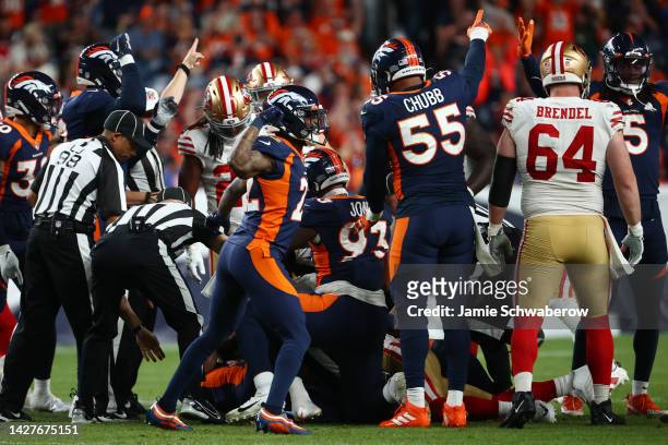 Kareem Jackson and Bradley Chubb of the Denver Broncos celebrate after a fumble recovery against the San Francisco 49ers at Empower Field At Mile...