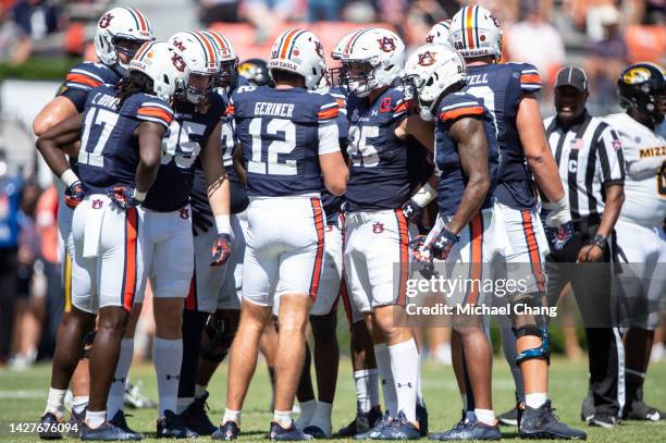 Members of the Auburn Tigers huddle around quarterback Holden Geriner of the Auburn Tigers during their game against the Missouri Tigers at...