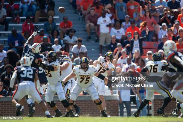 Quarterback Brady Cook of the Missouri Tigers throws the ball in traffic during their game against the Auburn Tigers at Jordan-Hare Stadium on...