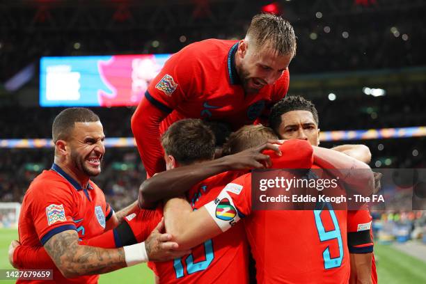 Harry Kane of England celebrates team mates after scoring their team's third goal from the penalty spot during the UEFA Nations League League A Group...