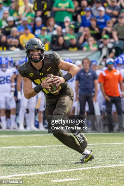 Quarterback Bo Nix of the Oregon Ducks runs with the ball against the Brigham Young Cougars during the first half at Autzen Stadium on September 17,...