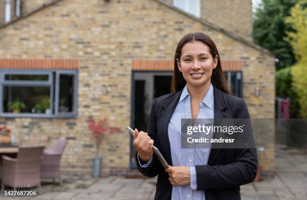 portrait of a happy real estate agent - uk estate agent stock pictures, royalty-free photos & images