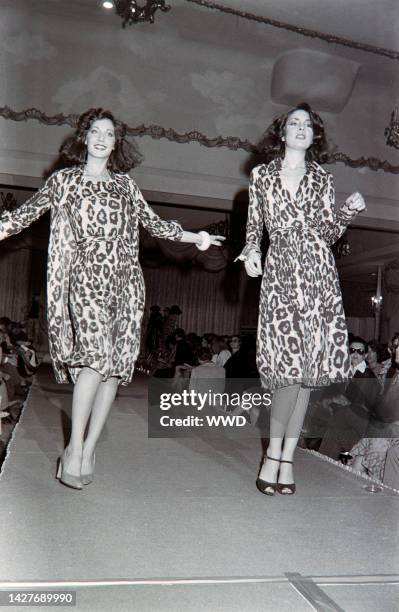 Models walk the runway in Diane Von Furstenberg's animal print wrap dresses from her Fall 1976 ready to wear collection.