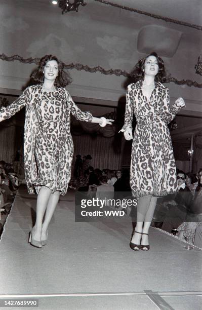 Models walk the runway in Diane Von Furstenberg's animal print wrap dresses from her Fall 1976 ready to wear collection.