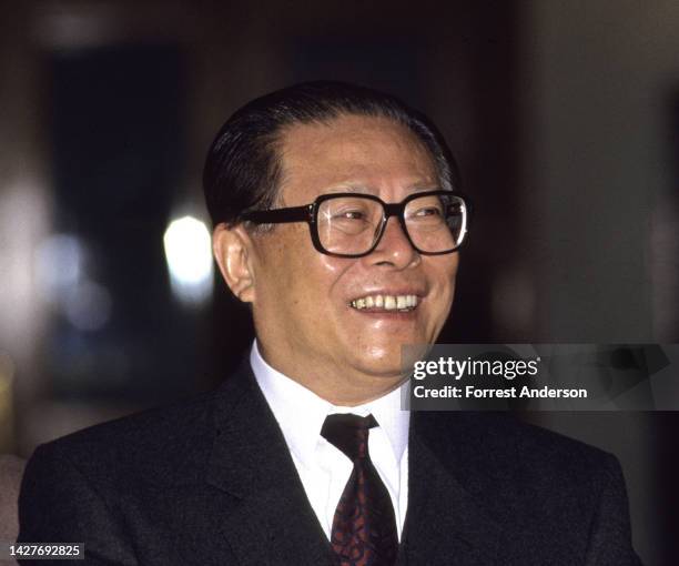 View of Chinese politician & General Secretary of the Chinese Communist Party Jiang Zemin as he laughs during an unspecified event in the Great Hall...