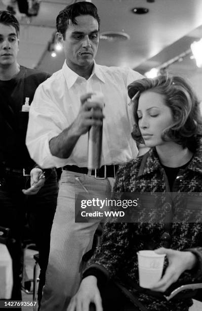 Hairstylist Oribe and assistant style model Christy Turlington's hair.