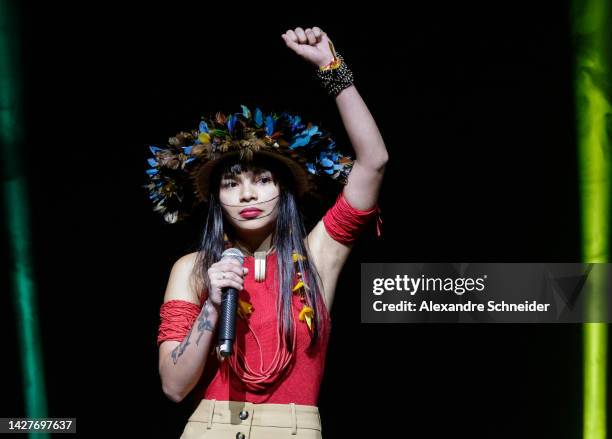 Indigenous activist, Txai Surui, speaks to supporters during a gathering with artists, politicians and other personalities one week before the...