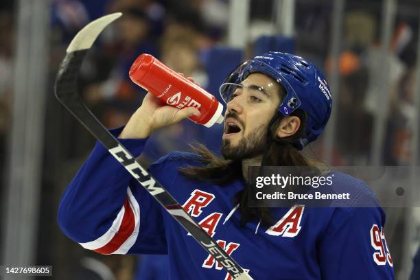 Mika Zibanejad of the New York Rangers takes a water break during warm-ups prior to the game against the New York Islanders at Madison Square Garden...