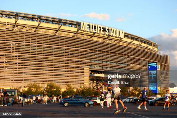 New York Giants play football outside of the stadium prior to the game between the Dallas Cowboys and the New York Giants at MetLife Stadium on...