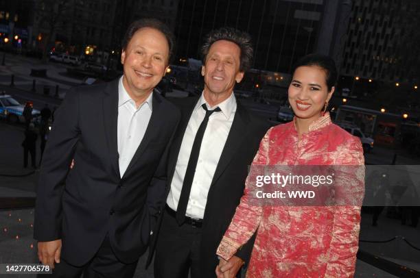 Actor Billy Crystal, producer Brian Grazer and Chosan Nguyen attend Vanity Fair's party for the opening of the Tribeca Film Festival at the Supreme...