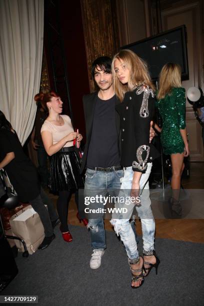 Designer Christophe Decarnin and model Anna Selezneva backstage at Balmain\'s spring 2009 show at the Hotel Westin in Paris.