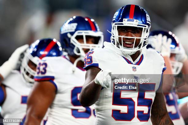 Jihad Ward of the New York Giants points prior to the game against the Dallas Cowboys at MetLife Stadium on September 26, 2022 in East Rutherford,...