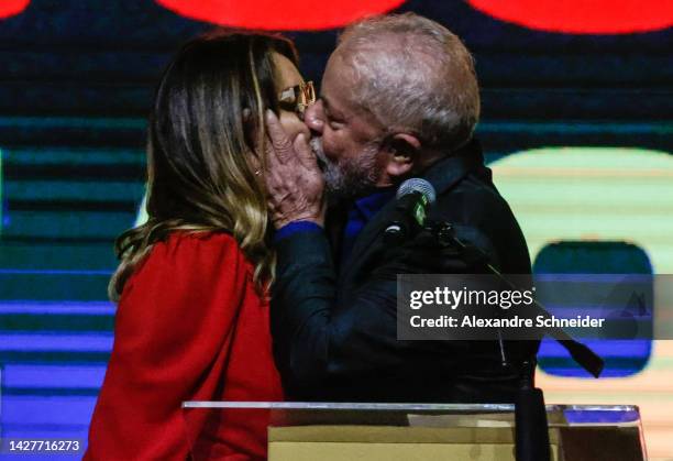 Brazil's former president and current presidential candidate Luiz Inacio Lula da Silva kisses his wife Rosangela da Silva during a gathering with...
