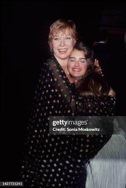 American actors Shirley MacLaine and Brooke Shields embrace at an event to Shields' movie 'Blue Lagoon' at the St Moritz Hotel, New York, New York,...