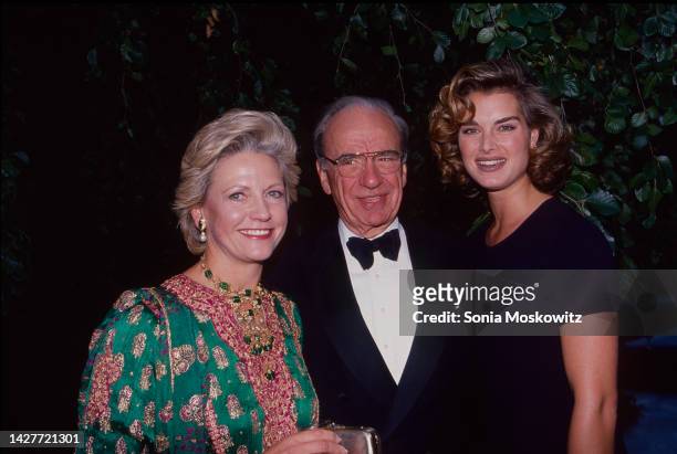 Portrait of, from left, married couple, Scottish journalist Anna Murdoch Mann & Australian-American businessman Rupert Murdoch, and American actor &...
