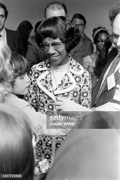 Congresswoman Shirley Chisholm and guests attend a party for her 1972 presidential campaign.
