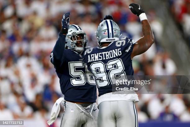 Dante Fowler Jr. #56 and Dorance Armstrong of the Dallas Cowboys celebrate a defensive stop against the New York Giants during the second quarter in...