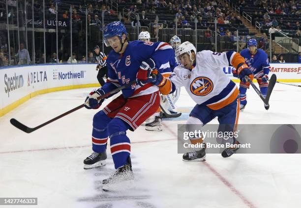 Cole Bardreau of the New York Islanders skates against Jacob Trouba of the New York Rangers during the third period at Madison Square Garden on...