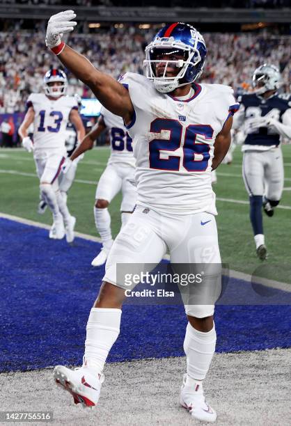 Saquon Barkley of the New York Giants celebrates after scoring a 36 yard touchdown against the Dallas Cowboys during the third quarter in the game at...