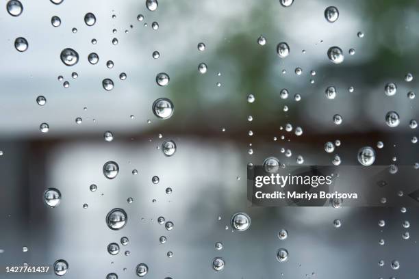 a window with raindrops on it. - storm outside window stock pictures, royalty-free photos & images