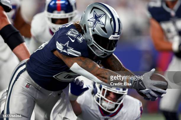 Ezekiel Elliott of the Dallas Cowboys scores a touchdown against the New York Giants during the third quarter in the game at MetLife Stadium on...