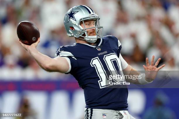 Cooper Rush of the Dallas Cowboys throws a pass against the New York Giants during the third quarter in the game at MetLife Stadium on September 26,...