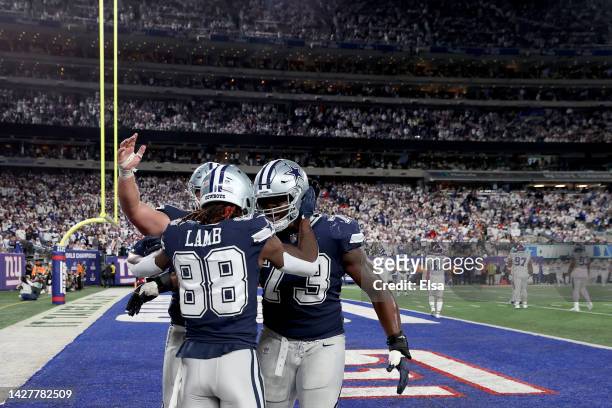 CeeDee Lamb of the Dallas Cowboys celebrates with his teammates after scoring a touchdown against the New York Giants during the fourth quarter in...