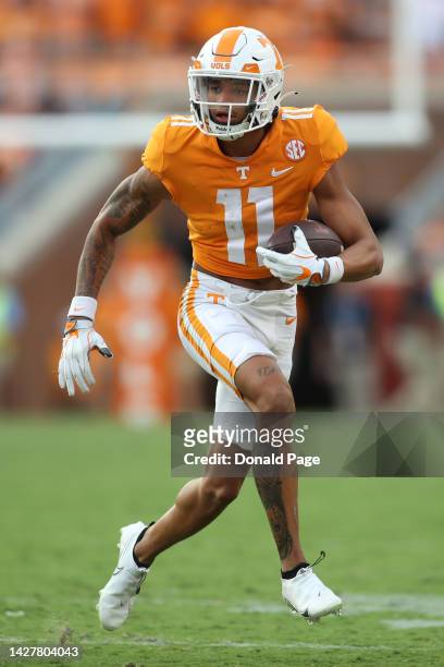 Jalin Hyatt of the Tennessee Volunteers runs with the ball against the Florida Gators at Neyland Stadium on September 24, 2022 in Knoxville,...